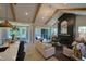 Spacious living room with fireplace and access to backyard patio at 1565 Bowers Store Rd, Siler City, NC 27344