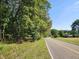 Wooded lot with road frontage and potential for a beautiful home at 1565 Bowers Store Rd, Siler City, NC 27344