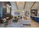 Spacious living room features a floor-to-ceiling fireplace and exposed wooden beams at 1565 Bowers Store Rd, Siler City, NC 27344