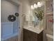 Modern bathroom with a sleek vanity, large mirror, and fresh decor at 1565 Bowers Store Rd, Siler City, NC 27344