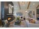 Spacious living room features a floor-to-ceiling fireplace and exposed wooden beams at 1565 Bowers Store Rd, Siler City, NC 27344