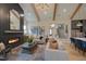 Spacious living room features a floor-to-ceiling fireplace and exposed wooden beams at 1565 Bowers Store Rd, Siler City, NC 27344