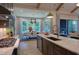 Open concept kitchen with dining area and access to outdoor patio at 1565 Bowers Store Rd, Siler City, NC 27344