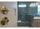 Luxurious shower with built-in seat and modern fixtures at 1565 Bowers Store Rd, Siler City, NC 27344