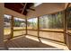 Relaxing screened porch with wood flooring and ceiling fan at 3806 River Mill Ln, Franklinton, NC 27525