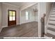 Bright and spacious entryway with hardwood floors and staircase at 3806 River Mill Ln, Franklinton, NC 27525