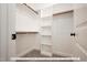 Spacious walk-in closet with built-in shelves and hanging rods at 3806 River Mill Ln, Franklinton, NC 27525