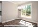 Bright breakfast nook with large window overlooking backyard at 3806 River Mill Ln, Franklinton, NC 27525