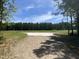 Vacant land with a cleared area and gravel driveway at 3806 River Mill Ln, Franklinton, NC 27525