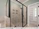 Walk in shower with tile surround and built in shelving at 3806 River Mill Ln, Franklinton, NC 27525