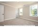 Bedroom with carpet and two windows at 3806 River Mill Ln, Franklinton, NC 27525