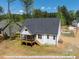 Aerial view showcasing the home's rear screened porch and backyard at 3806 River Mill Ln, Franklinton, NC 27525