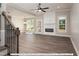 Spacious living room with fireplace, hardwood floors, and lots of natural light at 3806 River Mill Ln, Franklinton, NC 27525