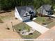 Aerial view of a charming two-story home with a large front yard at 3806 River Mill Ln, Franklinton, NC 27525