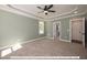 Primary bedroom with ceiling fan and access to en-suite bathroom at 3806 River Mill Ln, Franklinton, NC 27525