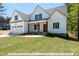 Two story home with white siding, gray roof, and attached two-car garage at 3806 River Mill Ln, Franklinton, NC 27525