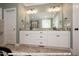 Double vanity bathroom with granite countertop and large mirror at 3806 River Mill Ln, Franklinton, NC 27525