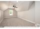 Bright bonus room featuring a ceiling fan and neutral carpeting at 3806 River Mill Ln, Franklinton, NC 27525