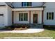Craftsman style home with white siding, brown pillars, and stone accents at 3806 River Mill Ln, Franklinton, NC 27525