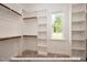 Large walk-in closet with ample shelving and hanging space at 3806 River Mill Ln, Franklinton, NC 27525