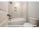 Bathroom with tiled shower and bathtub at 3806 River Mill Ln, Franklinton, NC 27525