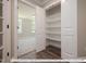 Walk-in pantry with white shelves at 3806 River Mill Ln, Franklinton, NC 27525