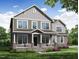 Two-story home with gray siding, stone accents, and a front porch at 111 Demascus Way, Four Oaks, NC 27524