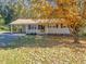 Ranch home with carport and mature trees at 112 Bradsher Rd, Roxboro, NC 27574