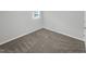 Simple bedroom with neutral carpeting and a window at 112 Bradsher Rd, Roxboro, NC 27574