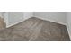 Simple bedroom with neutral carpeting and an adjacent closet at 112 Bradsher Rd, Roxboro, NC 27574