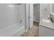Clean bathroom with a bathtub, vanity, and hexagon tile floor at 112 Bradsher Rd, Roxboro, NC 27574