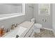 Clean bathroom with a white vanity and hexagon tile flooring at 112 Bradsher Rd, Roxboro, NC 27574