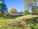 Ranch style home exterior with a tree covered yard at 112 Bradsher Rd, Roxboro, NC 27574