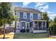 Two-story house with gray siding, screened porch, and backyard at 228 Vintage Point Ln, Wendell, NC 27591