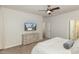 Bright bedroom with dresser and mounted TV at 228 Vintage Point Ln, Wendell, NC 27591