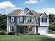 Two-story home with stone and blue siding at 3209 Olive Farm Rd # 311, New Hill, NC 27562