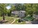 House with a stone facade, landscaping, and walkway at 2445 Pineway Dr, Burlington, NC 27215