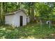 Two storage sheds in a wooded backyard at 2445 Pineway Dr, Burlington, NC 27215