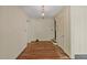Hardwood floors, neutral walls, and a view of the living room from entry at 2445 Pineway Dr, Burlington, NC 27215
