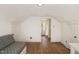 Unfinished attic bedroom with hardwood floors at 2445 Pineway Dr, Burlington, NC 27215