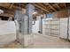 Unfinished basement with HVAC unit and shelving at 2445 Pineway Dr, Burlington, NC 27215
