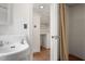 Small bathroom with pedestal sink and built-in shelving at 2445 Pineway Dr, Burlington, NC 27215