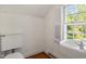 Small bathroom with pedestal sink and toilet at 2445 Pineway Dr, Burlington, NC 27215
