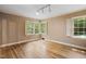 Bright bedroom with hardwood floors and plantation shutters at 2445 Pineway Dr, Burlington, NC 27215