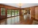 Spacious living room with hardwood floors and large windows at 2445 Pineway Dr, Burlington, NC 27215
