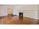 Living room with hardwood floors and a fireplace at 2445 Pineway Dr, Burlington, NC 27215