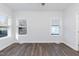 Bright bedroom with ample natural light and wood-look flooring at 1720 Blackwell Rd, Burlington, NC 27217