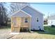 Charming gray home with yellow door and covered porch at 1720 Blackwell Rd, Burlington, NC 27217