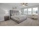 Spacious primary bedroom with large bed and plenty of natural light at 810 Rolling Wheel Rd, Mebane, NC 27302