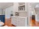 White kitchen cabinets with quartz countertops and built-in coffee maker at 93 Shoreline Dr, Princeton, NC 27569